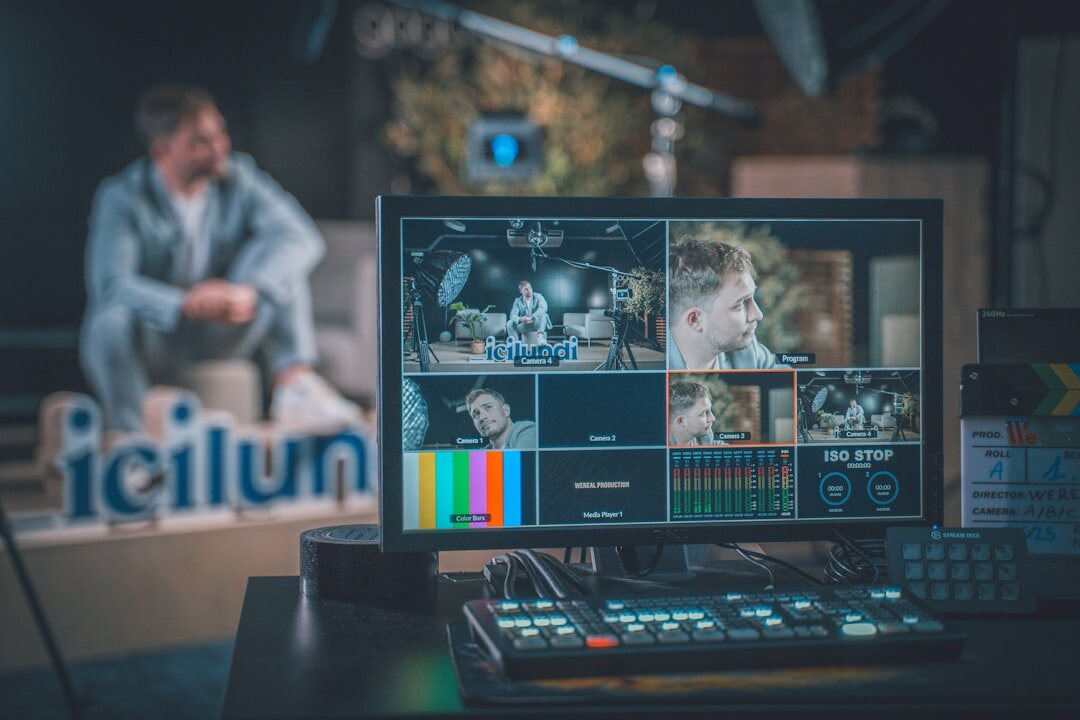 Video control room with multiple broadcast monitors and mixing console